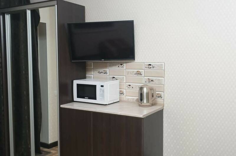 Семейный номер с мини-кухней на 2−4 чел