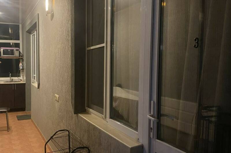 Трехместный номер с кухней на балконе