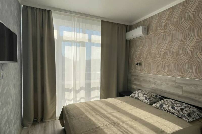 Двухкомнатный номер с обеденной зоной на третьем