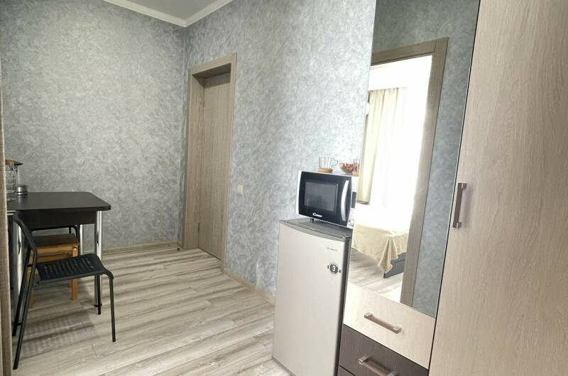 Двухкомнатный номер с обеденной зоной на третьем