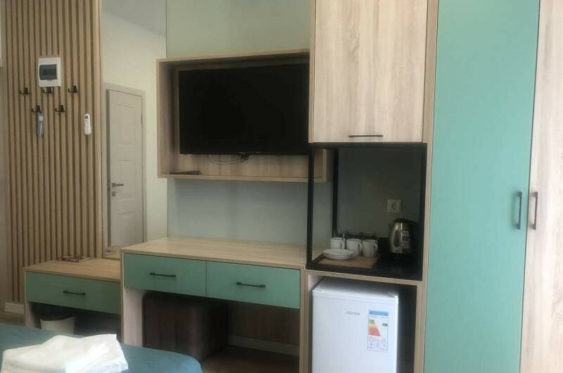 Трёхместный номер с патио и кухней