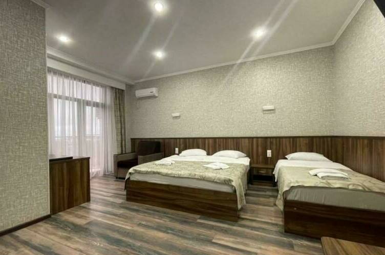 Четырехместный Делюкс с балконом видом на море