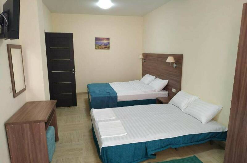 Четырехместный номер «Делюкс» с балконом